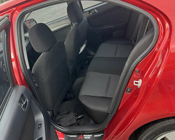 Червоний Міцубісі Lancer, об'ємом двигуна 2 л та пробігом 150 тис. км за 7000 $, фото 12 на Automoto.ua
