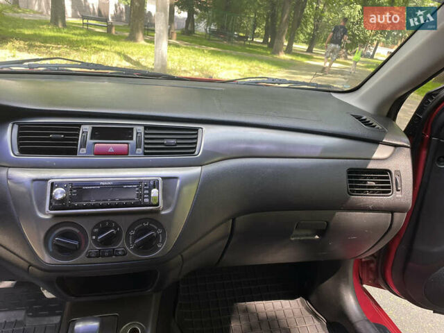 Червоний Міцубісі Lancer, об'ємом двигуна 1.6 л та пробігом 270 тис. км за 5699 $, фото 43 на Automoto.ua