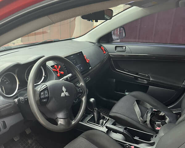 Червоний Міцубісі Lancer, об'ємом двигуна 2 л та пробігом 209 тис. км за 6900 $, фото 10 на Automoto.ua