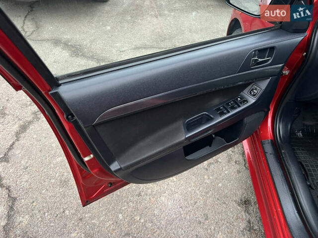 Красный Мицубиси Лансер, объемом двигателя 2 л и пробегом 330 тыс. км за 5250 $, фото 17 на Automoto.ua
