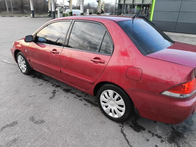 Червоний Міцубісі Lancer, об'ємом двигуна 1.6 л та пробігом 140 тис. км за 6000 $, фото 4 на Automoto.ua