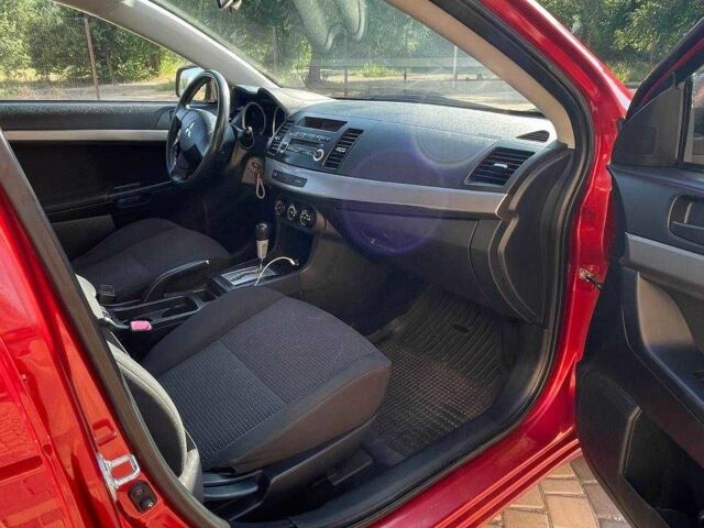 Червоний Міцубісі Lancer, об'ємом двигуна 1.5 л та пробігом 211 тис. км за 6900 $, фото 9 на Automoto.ua