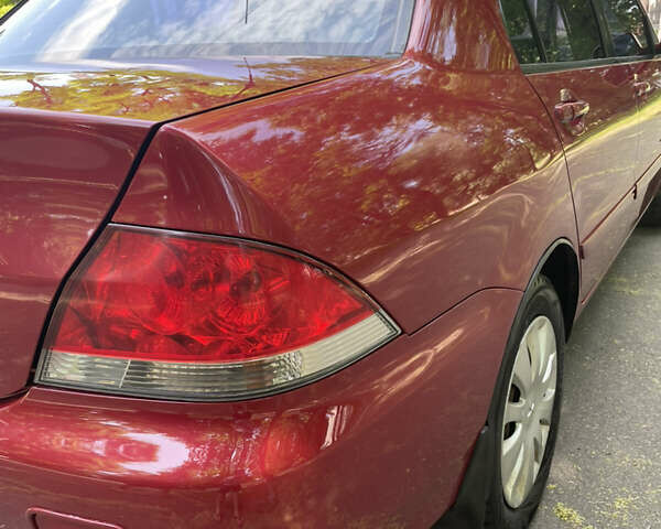 Червоний Міцубісі Lancer, об'ємом двигуна 1.6 л та пробігом 270 тис. км за 5699 $, фото 16 на Automoto.ua