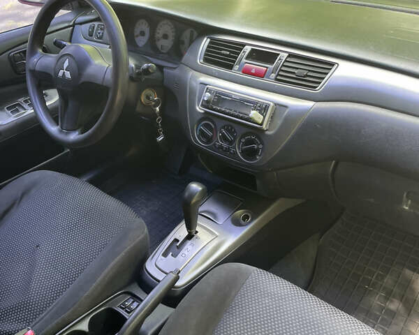 Червоний Міцубісі Lancer, об'ємом двигуна 1.6 л та пробігом 270 тис. км за 5699 $, фото 57 на Automoto.ua