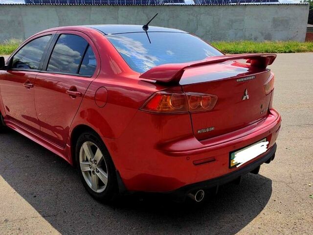 Красный Мицубиси Лансер, объемом двигателя 2 л и пробегом 300 тыс. км за 6200 $, фото 1 на Automoto.ua