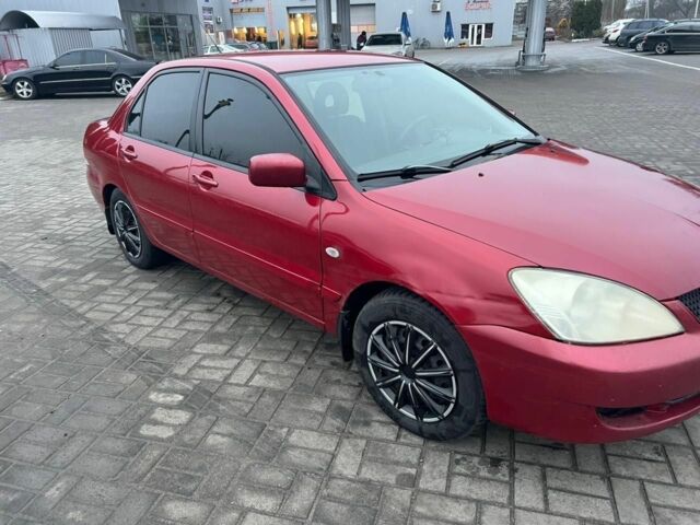 Красный Мицубиси Лансер, объемом двигателя 1.6 л и пробегом 265 тыс. км за 2956 $, фото 3 на Automoto.ua