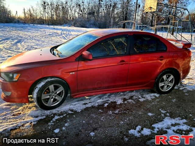 Красный Мицубиси Лансер, объемом двигателя 2 л и пробегом 200 тыс. км за 5500 $, фото 1 на Automoto.ua