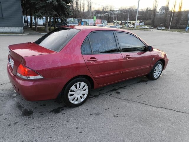Червоний Міцубісі Lancer, об'ємом двигуна 1.6 л та пробігом 140 тис. км за 6000 $, фото 2 на Automoto.ua