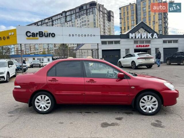 Червоний Міцубісі Lancer, об'ємом двигуна 1.58 л та пробігом 223 тис. км за 6400 $, фото 11 на Automoto.ua