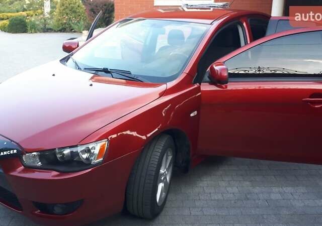 Червоний Міцубісі Lancer, об'ємом двигуна 2 л та пробігом 141 тис. км за 7600 $, фото 1 на Automoto.ua