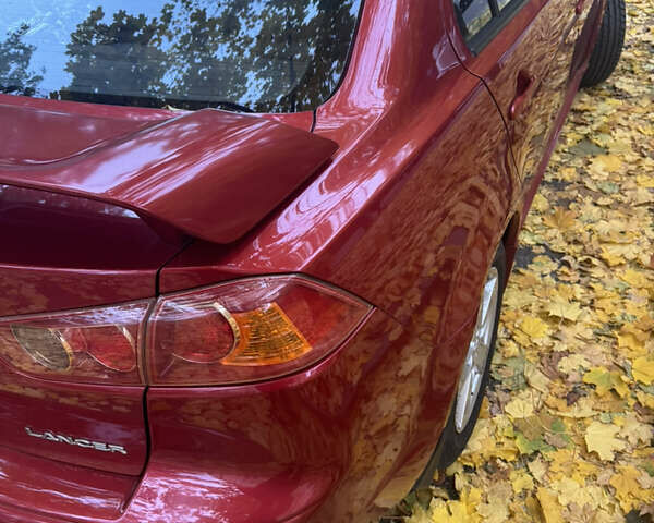Червоний Міцубісі Lancer, об'ємом двигуна 2 л та пробігом 203 тис. км за 8000 $, фото 15 на Automoto.ua