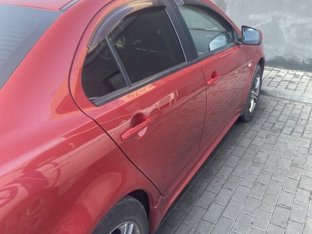 Червоний Міцубісі Lancer, об'ємом двигуна 2 л та пробігом 200 тис. км за 5350 $, фото 6 на Automoto.ua
