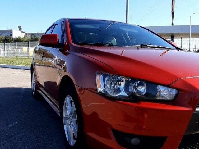 Красный Мицубиси Лансер, объемом двигателя 2 л и пробегом 110 тыс. км за 7500 $, фото 7 на Automoto.ua