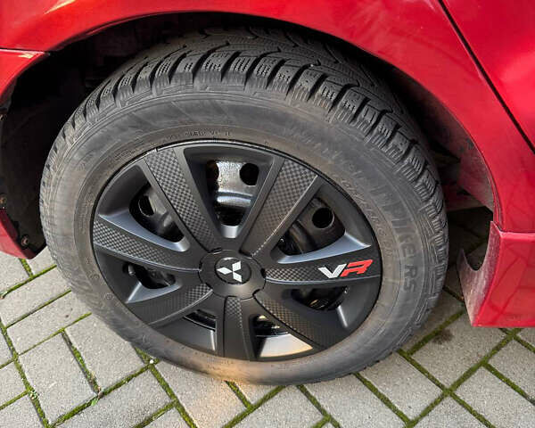 Красный Мицубиси Лансер, объемом двигателя 2 л и пробегом 143 тыс. км за 5200 $, фото 2 на Automoto.ua