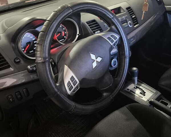 Красный Мицубиси Лансер, объемом двигателя 2 л и пробегом 65 тыс. км за 9300 $, фото 7 на Automoto.ua