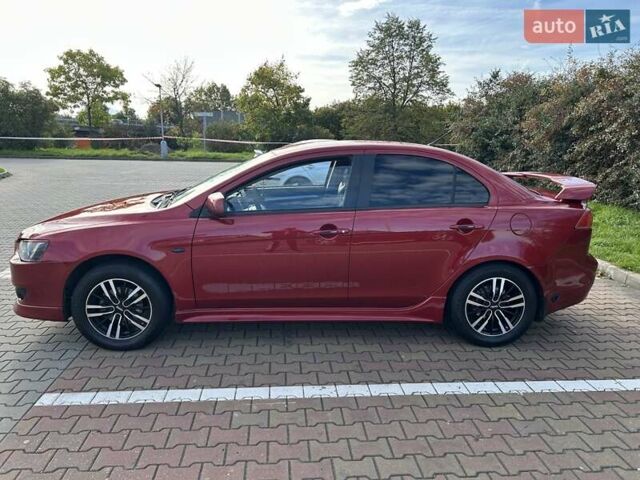 Красный Мицубиси Лансер, объемом двигателя 2 л и пробегом 227 тыс. км за 7000 $, фото 2 на Automoto.ua