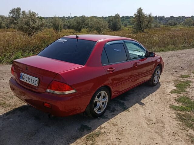 Червоний Міцубісі Lancer, об'ємом двигуна 1.6 л та пробігом 246 тис. км за 5000 $, фото 1 на Automoto.ua