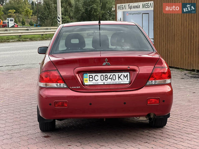 Красный Мицубиси Лансер, объемом двигателя 1.58 л и пробегом 133 тыс. км за 6750 $, фото 6 на Automoto.ua