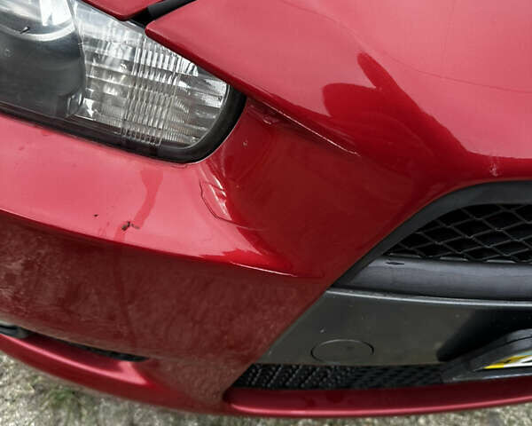 Красный Мицубиси Лансер, объемом двигателя 2 л и пробегом 92 тыс. км за 6500 $, фото 3 на Automoto.ua