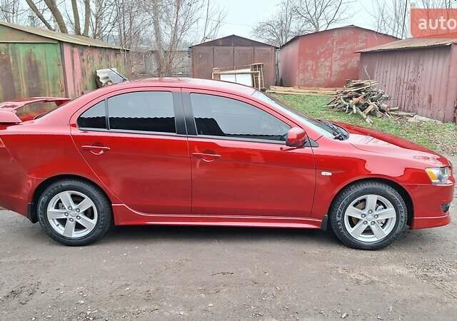 Красный Мицубиси Лансер, объемом двигателя 2 л и пробегом 120 тыс. км за 7800 $, фото 5 на Automoto.ua