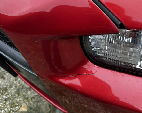 Красный Мицубиси Лансер, объемом двигателя 2 л и пробегом 92 тыс. км за 6500 $, фото 4 на Automoto.ua