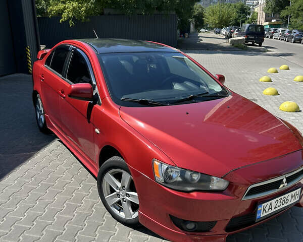 Мицубиси Лансер 2009 в Киеве на Automoto.ua Красный Мицубиси Лансер, объемом двигателя 2 л и пробегом 251 тыс. км за 6999 $, фото 2 на Automoto.ua