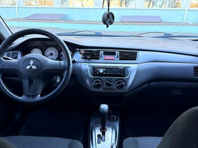 Червоний Міцубісі Lancer, об'ємом двигуна 1.6 л та пробігом 143 тис. км за 7000 $, фото 5 на Automoto.ua