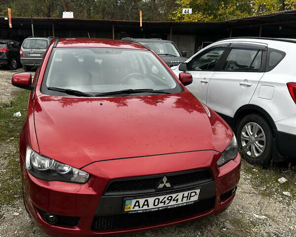 Красный Мицубиси Лансер, объемом двигателя 2 л и пробегом 92 тыс. км за 6500 $, фото 2 на Automoto.ua