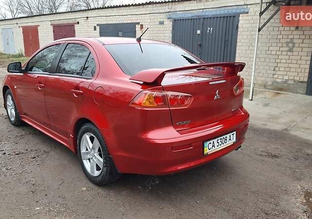 Красный Мицубиси Лансер, объемом двигателя 2 л и пробегом 120 тыс. км за 7800 $, фото 2 на Automoto.ua