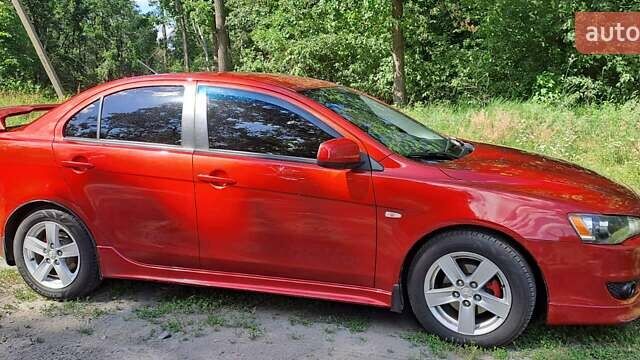 Червоний Міцубісі Lancer, об'ємом двигуна 2 л та пробігом 197 тис. км за 7300 $, фото 1 на Automoto.ua