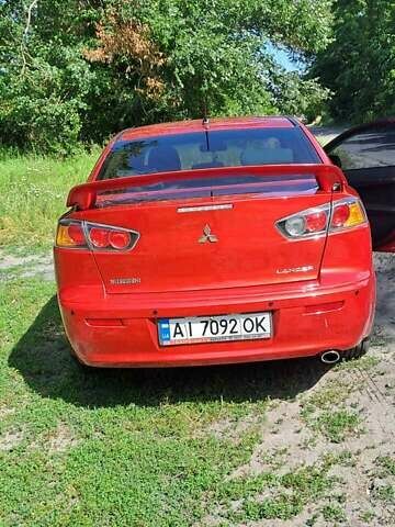 Червоний Міцубісі Lancer, об'ємом двигуна 2 л та пробігом 197 тис. км за 7300 $, фото 3 на Automoto.ua