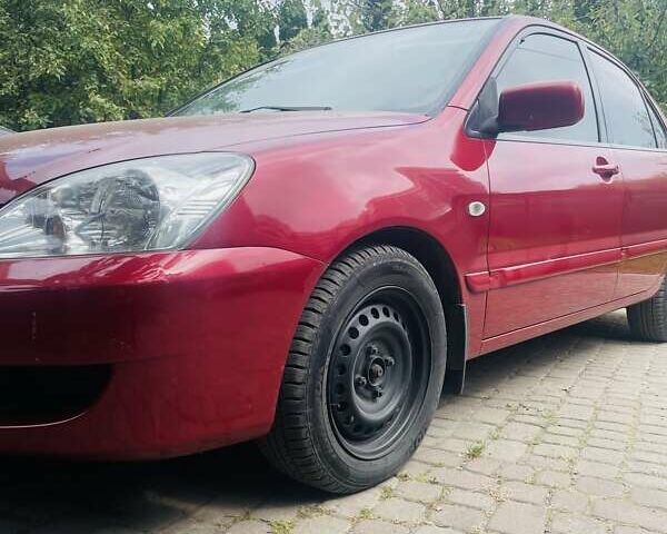 Червоний Міцубісі Lancer, об'ємом двигуна 1.58 л та пробігом 132 тис. км за 5300 $, фото 17 на Automoto.ua