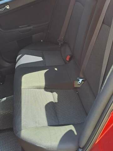 Червоний Міцубісі Lancer, об'ємом двигуна 2 л та пробігом 197 тис. км за 7300 $, фото 7 на Automoto.ua