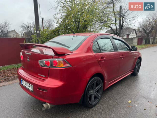 Красный Мицубиси Лансер, объемом двигателя 2 л и пробегом 246 тыс. км за 4900 $, фото 3 на Automoto.ua