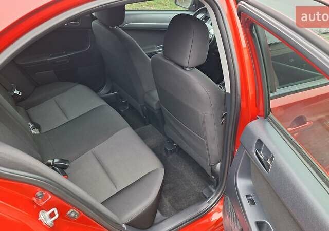 Красный Мицубиси Лансер, объемом двигателя 2 л и пробегом 120 тыс. км за 7800 $, фото 29 на Automoto.ua