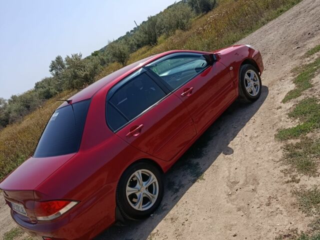 Червоний Міцубісі Lancer, об'ємом двигуна 1.6 л та пробігом 246 тис. км за 5000 $, фото 14 на Automoto.ua