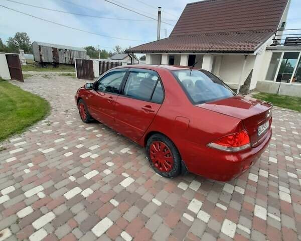 Красный Мицубиси Лансер, объемом двигателя 1.6 л и пробегом 127 тыс. км за 4700 $, фото 4 на Automoto.ua