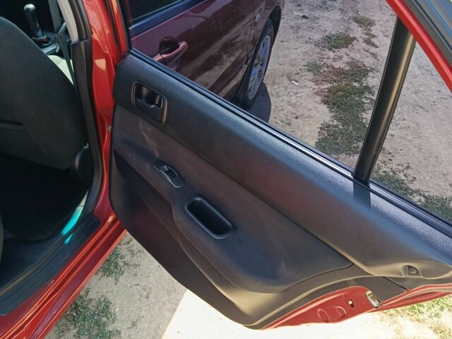 Червоний Міцубісі Lancer, об'ємом двигуна 1.6 л та пробігом 246 тис. км за 5000 $, фото 15 на Automoto.ua