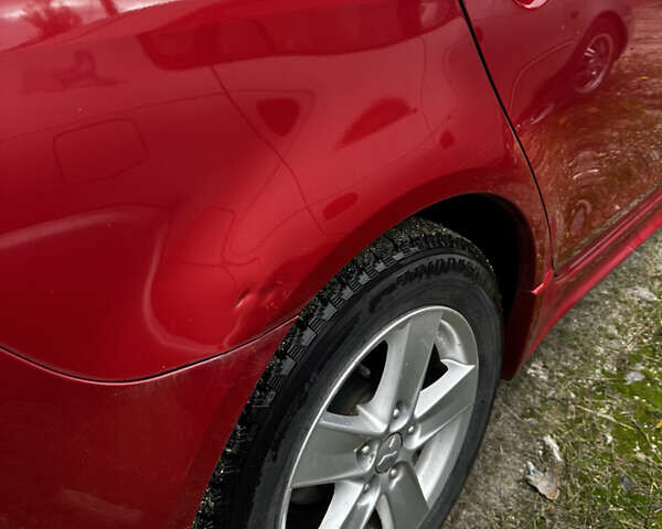 Красный Мицубиси Лансер, объемом двигателя 2 л и пробегом 92 тыс. км за 6500 $, фото 11 на Automoto.ua