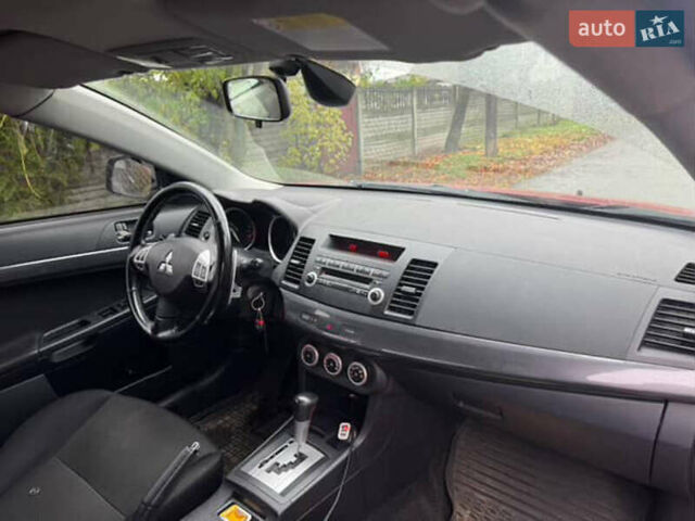 Красный Мицубиси Лансер, объемом двигателя 2 л и пробегом 246 тыс. км за 4900 $, фото 5 на Automoto.ua