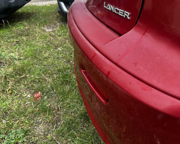 Красный Мицубиси Лансер, объемом двигателя 2 л и пробегом 92 тыс. км за 6500 $, фото 5 на Automoto.ua