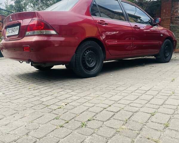 Червоний Міцубісі Lancer, об'ємом двигуна 1.58 л та пробігом 132 тис. км за 5300 $, фото 19 на Automoto.ua