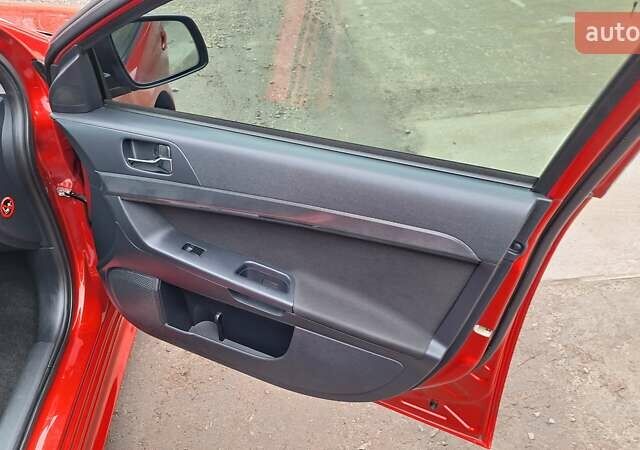 Красный Мицубиси Лансер, объемом двигателя 2 л и пробегом 120 тыс. км за 7800 $, фото 31 на Automoto.ua