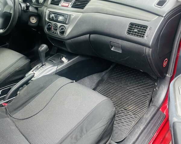 Червоний Міцубісі Lancer, об'ємом двигуна 1.58 л та пробігом 132 тис. км за 5300 $, фото 28 на Automoto.ua