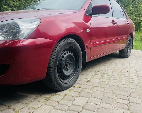 Червоний Міцубісі Lancer, об'ємом двигуна 1.58 л та пробігом 132 тис. км за 5300 $, фото 18 на Automoto.ua