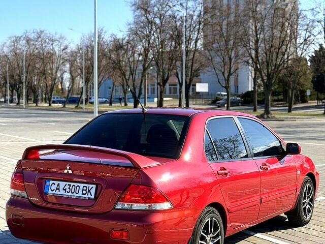 Червоний Міцубісі Lancer, об'ємом двигуна 1.6 л та пробігом 143 тис. км за 7000 $, фото 8 на Automoto.ua