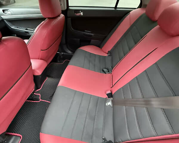 Красный Мицубиси Лансер, объемом двигателя 2 л и пробегом 170 тыс. км за 6300 $, фото 4 на Automoto.ua