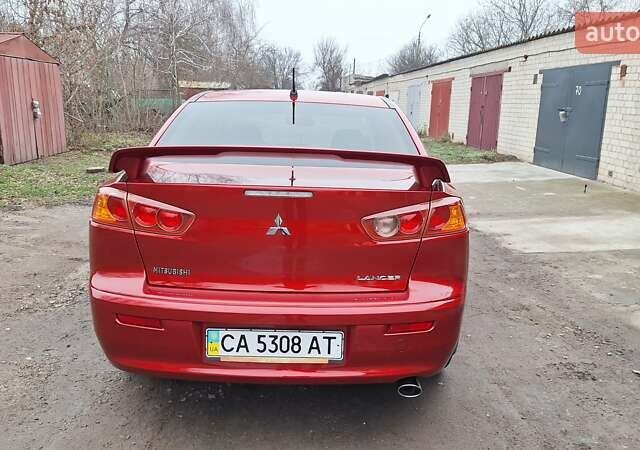 Красный Мицубиси Лансер, объемом двигателя 2 л и пробегом 120 тыс. км за 7800 $, фото 3 на Automoto.ua