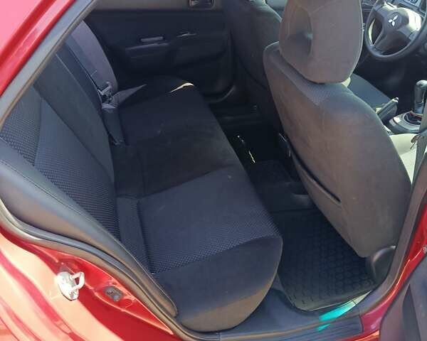 Червоний Міцубісі Lancer, об'ємом двигуна 1.6 л та пробігом 246 тис. км за 5500 $, фото 14 на Automoto.ua