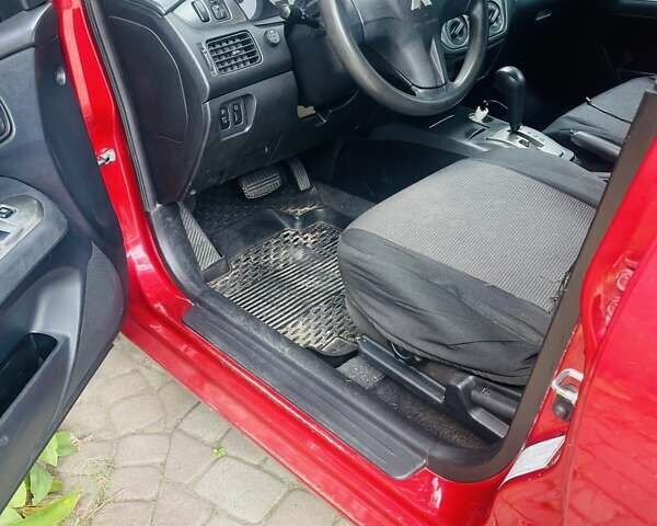 Червоний Міцубісі Lancer, об'ємом двигуна 1.58 л та пробігом 132 тис. км за 5300 $, фото 13 на Automoto.ua